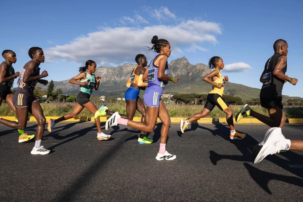 Runners racing under open sky